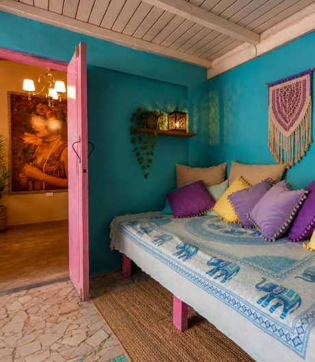 Family Room at Mammaloe’s Aruba with two beds and colorful decor
